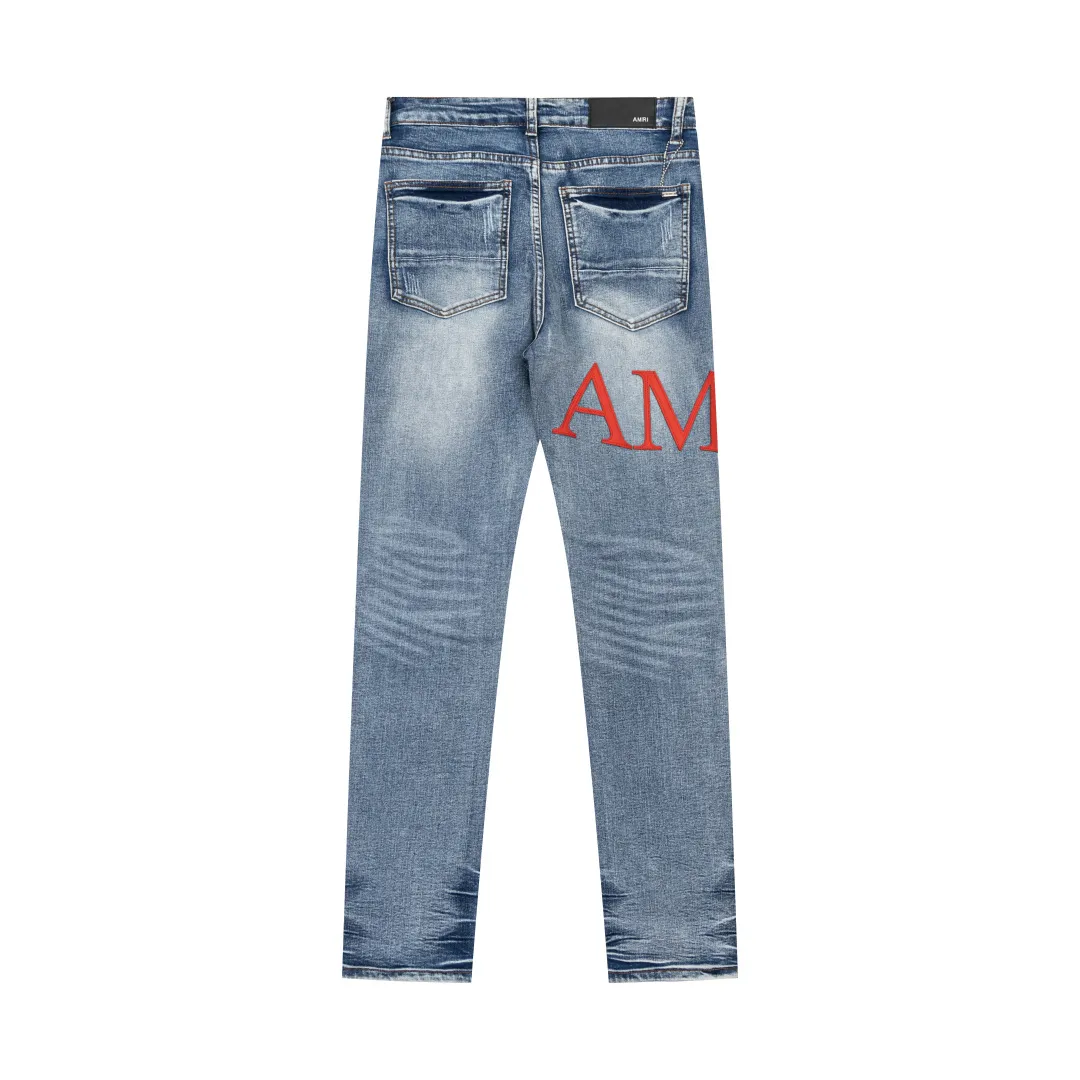 (Top version) AMIRI's new high-luxury heavy-duty stretch water patch embroidered high-street trendy men's and women's couple jeans AMIRI's family uses organic long-staple cotton denim fabrics originating in Los Angeles this year! After a pure natural alkaline phosphatase washing process, the special blue Gray tone is noble and high-end. It feels skin-friendly and delicate, and the inner layer is particularly comfortable when touching the skin! The elastic spandex component makes it particularly comfortable for daily activities. The original and rare Premium fabric is a rare find! Details after details! Amiri's New Arrival high street luxury jeans in Los Angeles mall! The front and back pieces have undergone a multi-layered three-dimensional polishing process, giving the upper body a stylish texture! The metal laser embossed MA metal Brown Nappa leather label on the waist is very exquisite! The pockets are also inlaid with tungsten steel metal logos, and the interior has exquisite ceiling-level workmanship! Hot sale jeans in Los Angeles counters! Enjoy the quality when you wear it yourself, and the value is high as a gift! Manage any large-scale business occasions and Premium private clubs without stress! Highly recommended to buy! Style number: 2053 Color: Blue Size: 28 30 32 34