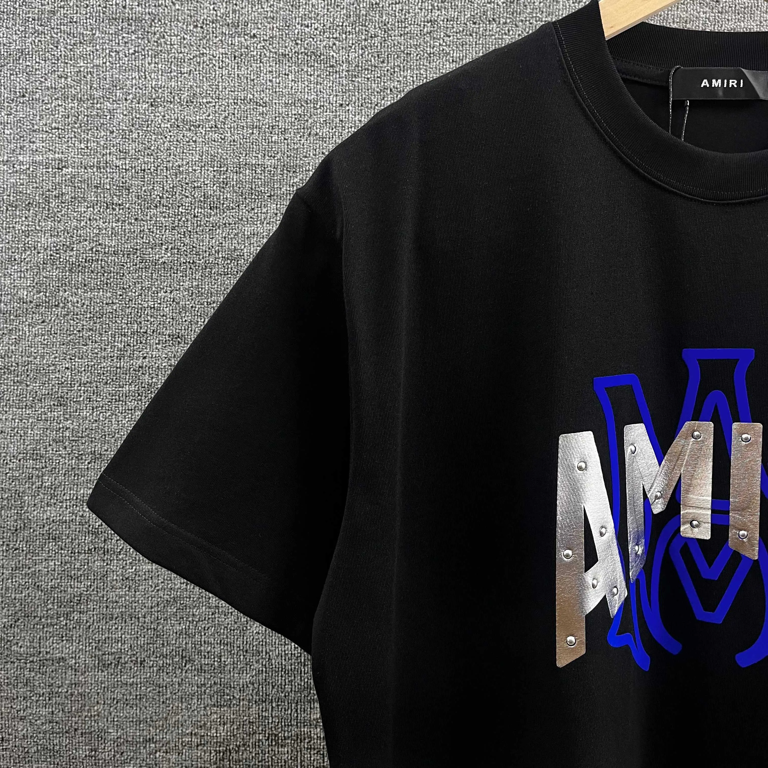 Amir*E*mir 2026 spring and summer New Arrival short-sleeved T-shirt Classic letters Silver silicone + flocking technology Customized plain cotton double yarn fabric Men and women Same Style Color: Black White Size: S (90-130 pounds) M (120-150 pounds) L (140-165 pounds) XL (160-180 pounds) XXL (180 pounds)
