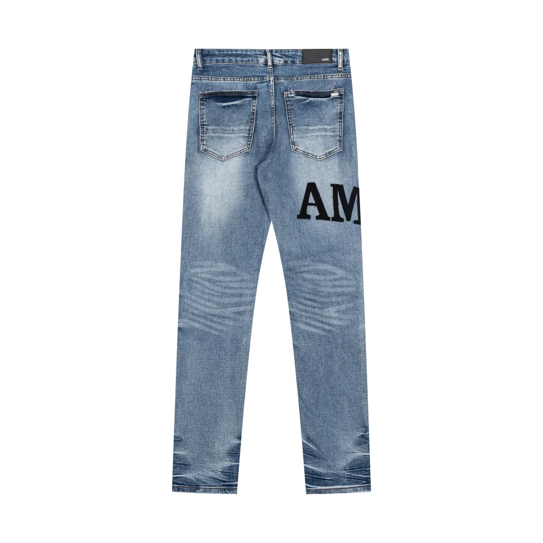 (Top version) AMIRI's new high-luxury heavy-duty stretch water patch embroidered high-street trendy men's and women's couple jeans AMIRI's family uses organic long-staple cotton denim fabrics originating in Los Angeles this year! After a pure natural alkaline phosphatase washing process, the special blue Gray tone is noble and high-end. It feels skin-friendly and delicate, and the inner layer is particularly comfortable when touching the skin! The elastic spandex component makes it particularly comfortable for daily activities. The original and rare Premium fabric is a rare find! Details after details! Amiri's New Arrival high street luxury jeans in Los Angeles mall! The front and back pieces have undergone a multi-layered three-dimensional polishing process, giving the upper body a stylish texture! The metal laser embossed MA metal Brown Nappa leather label on the waist is very exquisite! The pockets are also inlaid with tungsten steel metal logos, and the interior has exquisite ceiling-level workmanship! Hot sale jeans in Los Angeles counters! Enjoy the quality when you wear it yourself, and the value is high as a gift! Manage any large-scale business occasions and Premium private clubs without stress! Highly recommended to buy! Style number: 2056 Color: Blue Size: 28 30 32 34