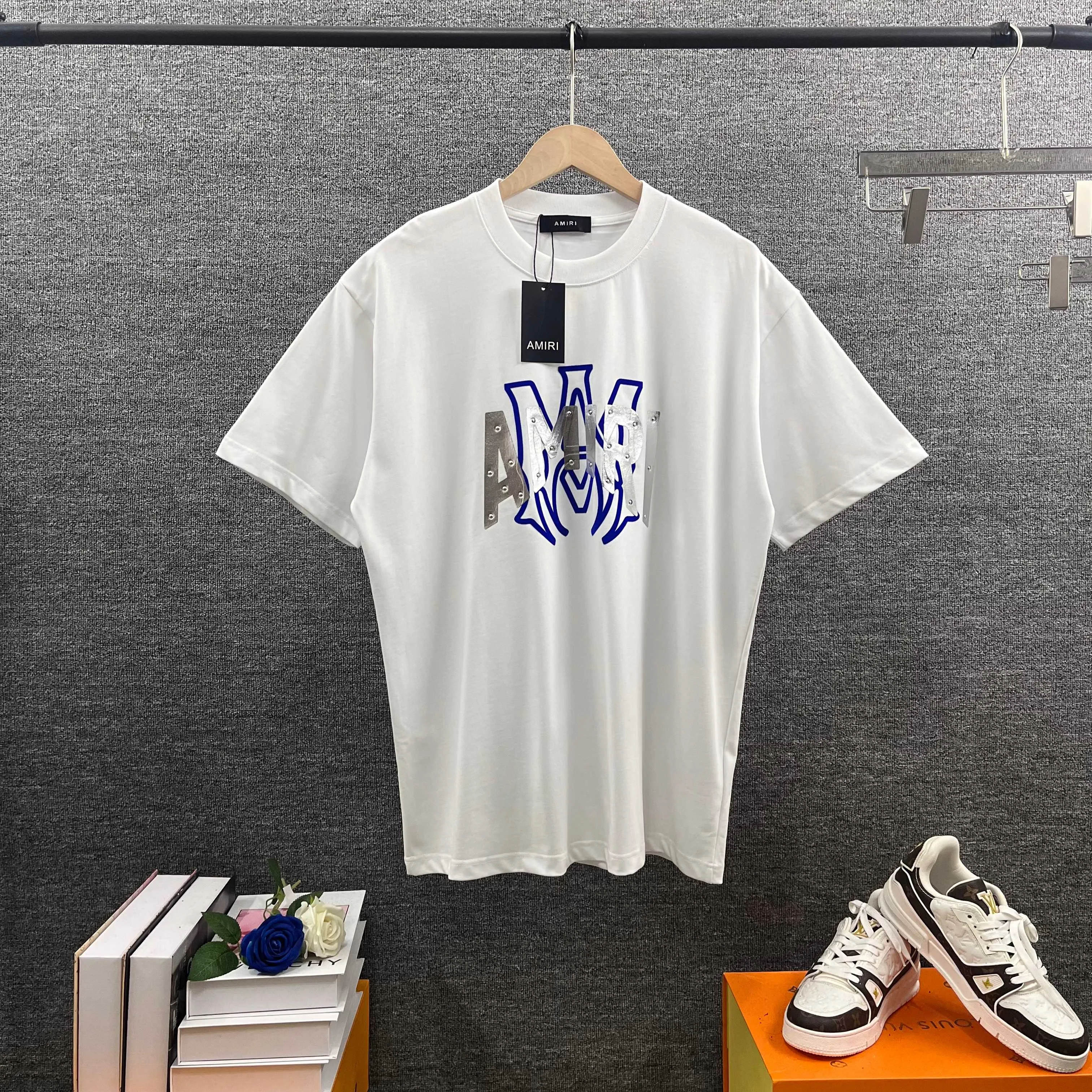 Amir*E*mir 2026 spring and summer New Arrival short-sleeved T-shirt Classic letters Silver silicone + flocking technology Customized plain cotton double yarn fabric Men and women Same Style Color: Black White Size: S (90-130 pounds) M (120-150 pounds) L (140-165 pounds) XL (160-180 pounds) XXL (180 pounds)