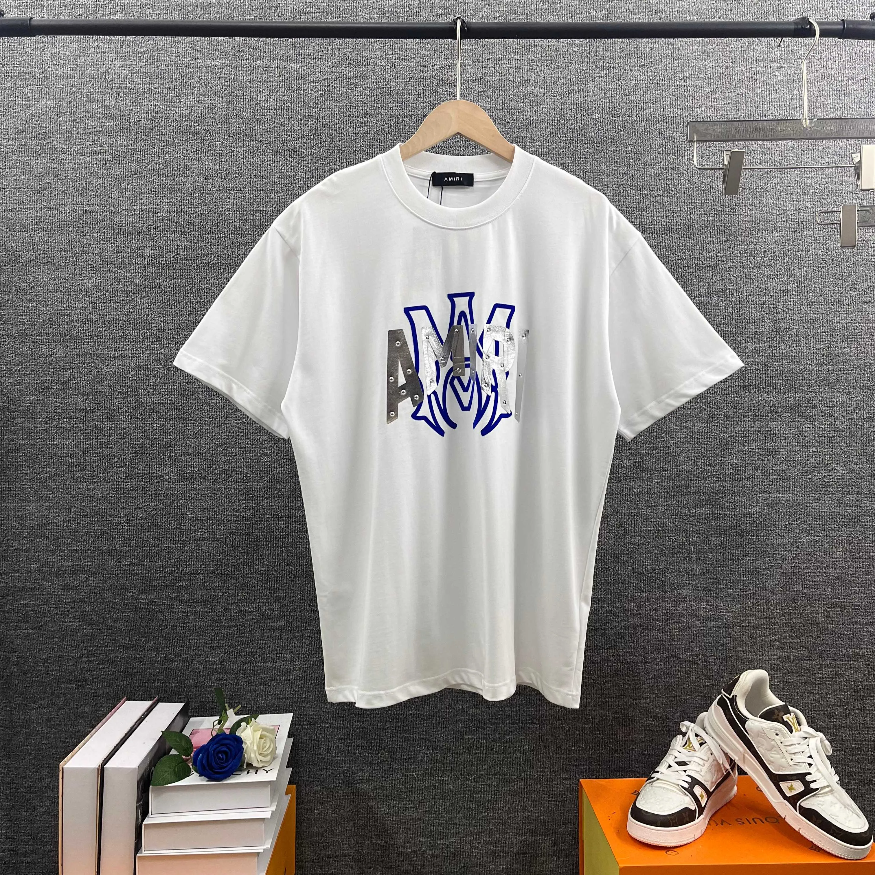 Amir*E*mir 2026 spring and summer New Arrival short-sleeved T-shirt Classic letters Silver silicone + flocking technology Customized plain cotton double yarn fabric Men and women Same Style Color: Black White Size: S (90-130 pounds) M (120-150 pounds) L (140-165 pounds) XL (160-180 pounds) XXL (180 pounds)