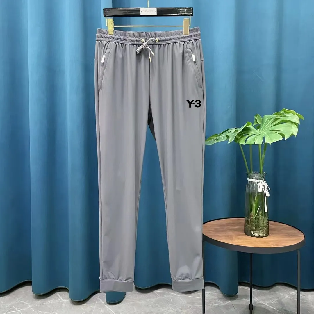 Y 3 annual New Arrival ice silk elastic quick-drying casual sports straight trousers with sun protection. These pants are very Versatile, with elastic waist and widened and thickened waistband! Straightforward design! 3D three-dimensional craftsmanship tailoring the upper body to highlight the figure! Selected ice silk four-way stretch fabric, comfortable and smooth to the touch! The drape is great! No pilling, no fading, cool and comfortable! Technical fabrics are really very technical! It’s like a single layer of skin! Extremely cool! ! Stretch fabric on all sides! It has elasticity both horizontally and vertically, and is very breathable! The upper body is very comfortable! Simple and elegant style! Not too much cumbersome design! Exquisite craftsmanship! Quality is in place! No need to say more about this! Once you buy it and wear it, you will know that it can be worn for daily work and outdoor sports. This style has been designed by many famous designers and is the perfect combination of fashion, leisure and outdoor sports, so it is your best choice whether you wear it daily or outdoors. Color: Black Gray Size S-XL